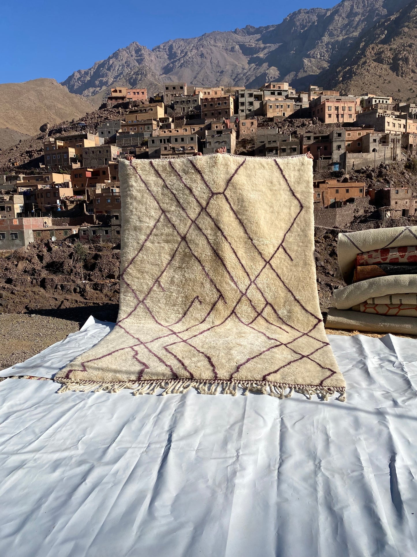 Beni Ourain rugs originate from the Atlas Mountains of Morocco and are characterized by their distinctive, neutral-toned, and geometric designs. These handwoven rugs often feature a plush pile and are made by the Berber tribes, size is 310x210 cm