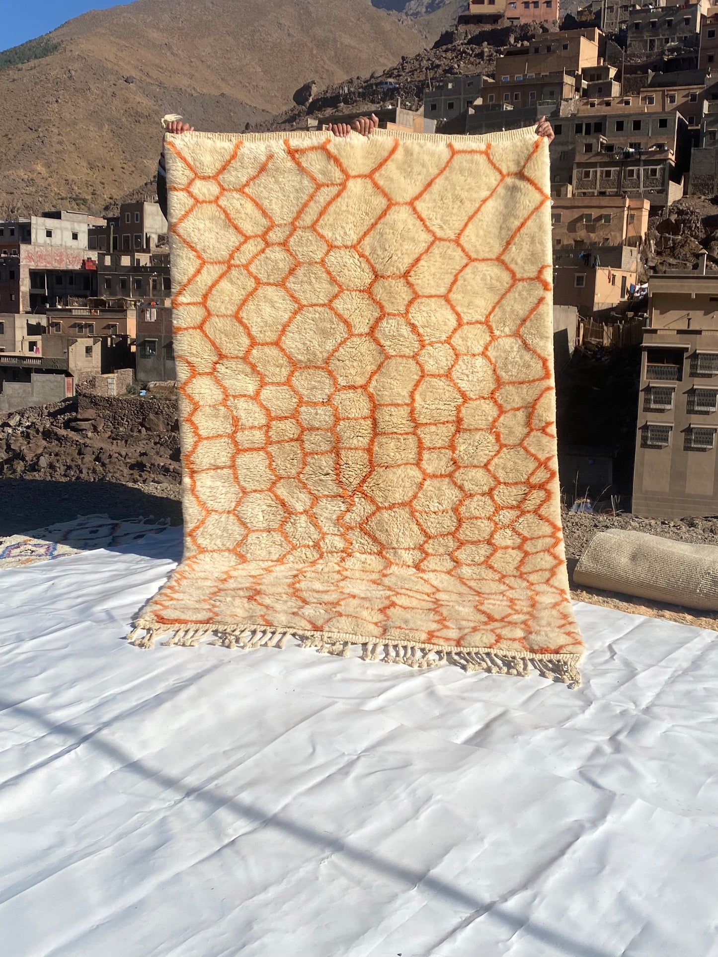 Beni Ourain rugs originate from the Atlas Mountains of Morocco and are characterized by their distinctive, neutral-toned, and geometric designs. These handwoven rugs often feature a plush pile and are made by the Berber tribes, size is 255x155 cm
