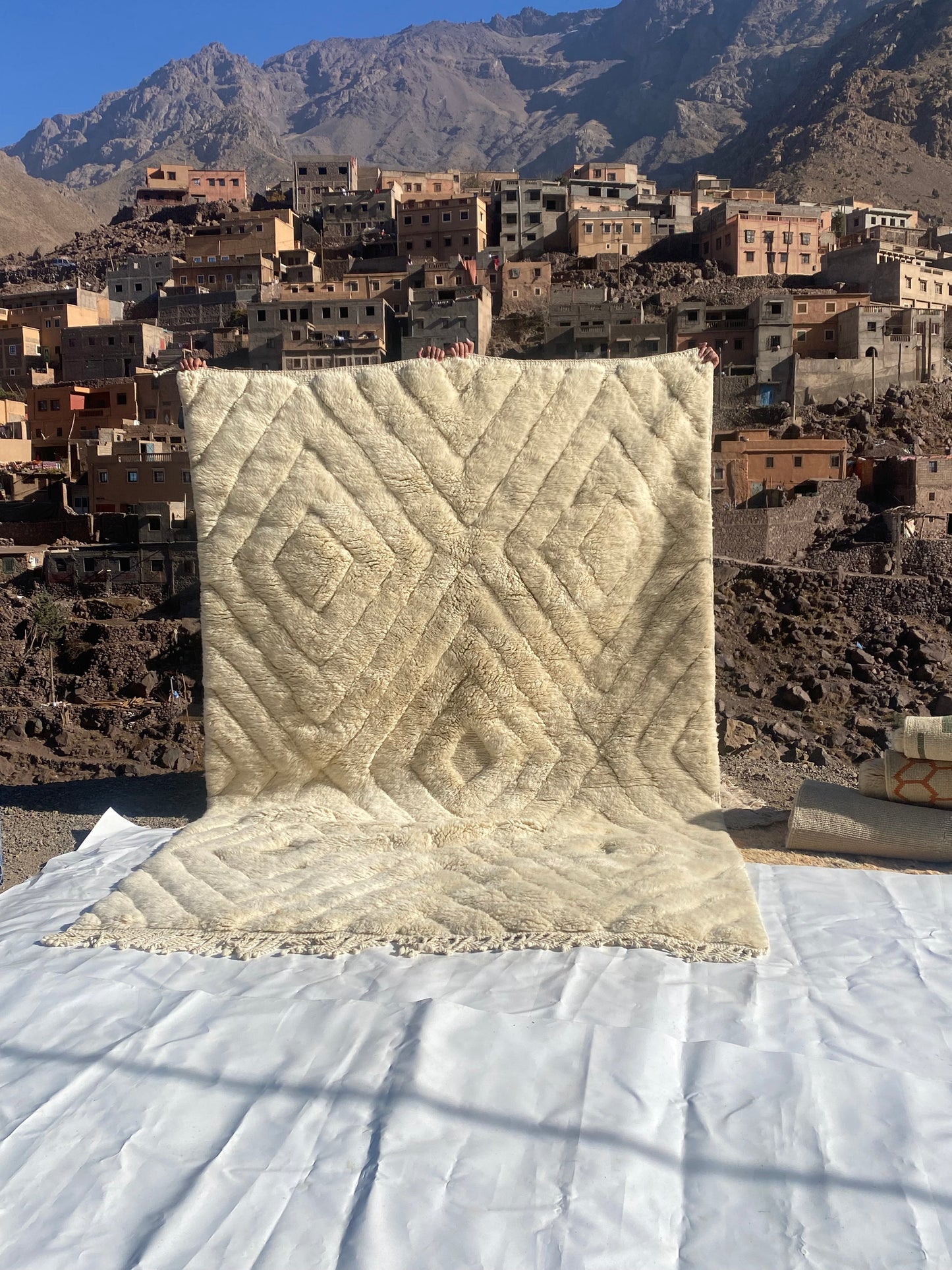 Beni Ourain rugs originate from the Atlas Mountains of Morocco and are characterized by their distinctive, neutral-toned, and geometric designs. These handwoven rugs often feature a plush pile and are made by the Berber tribes, size is 300x200 cm