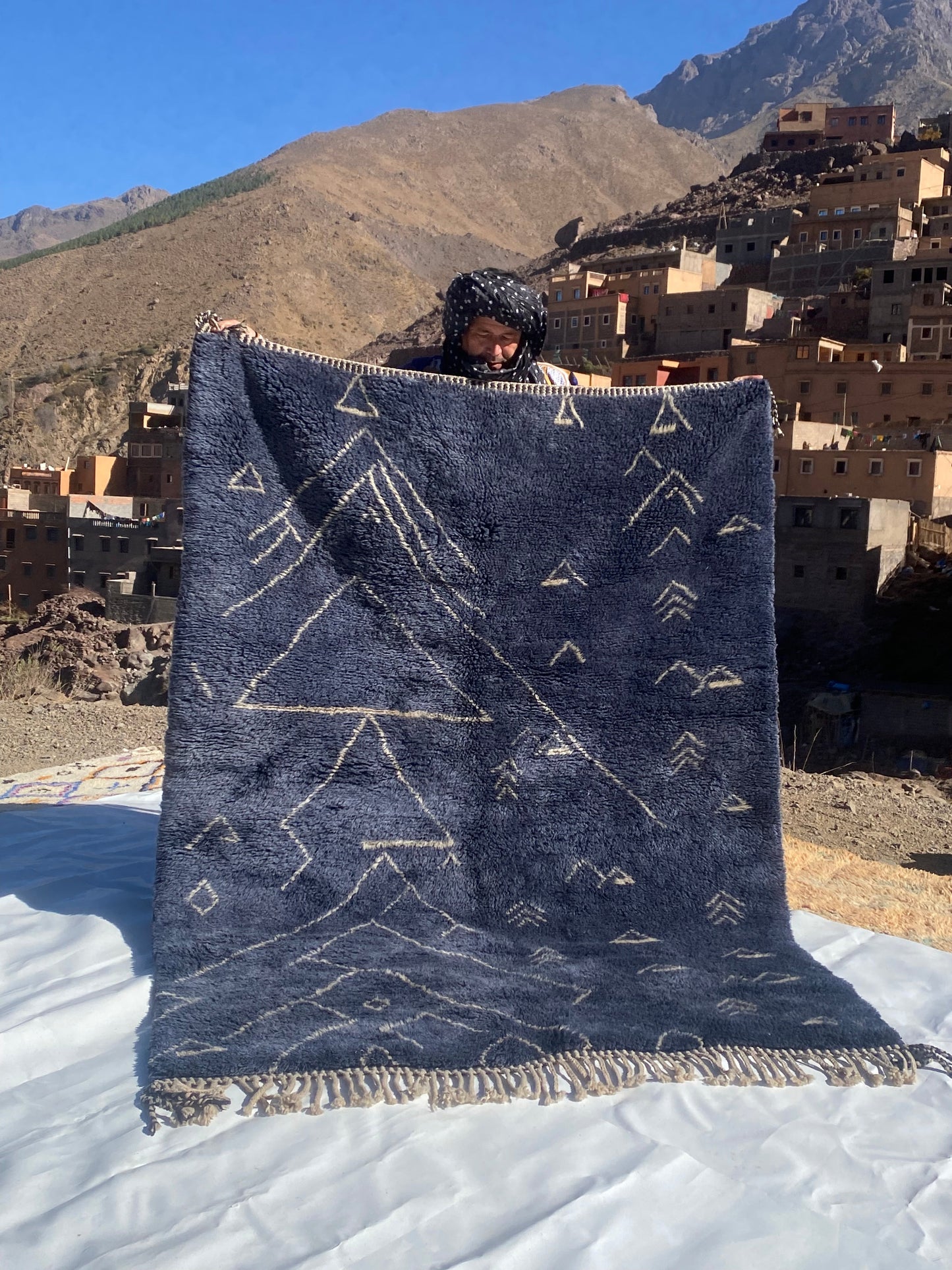 Beni Ourain rugs originate from the Atlas Mountains of Morocco and are characterized by their distinctive, neutral-toned, and geometric designs. These handwoven rugs often feature a plush pile and are made by the Berber tribes, size is 210x160 cm