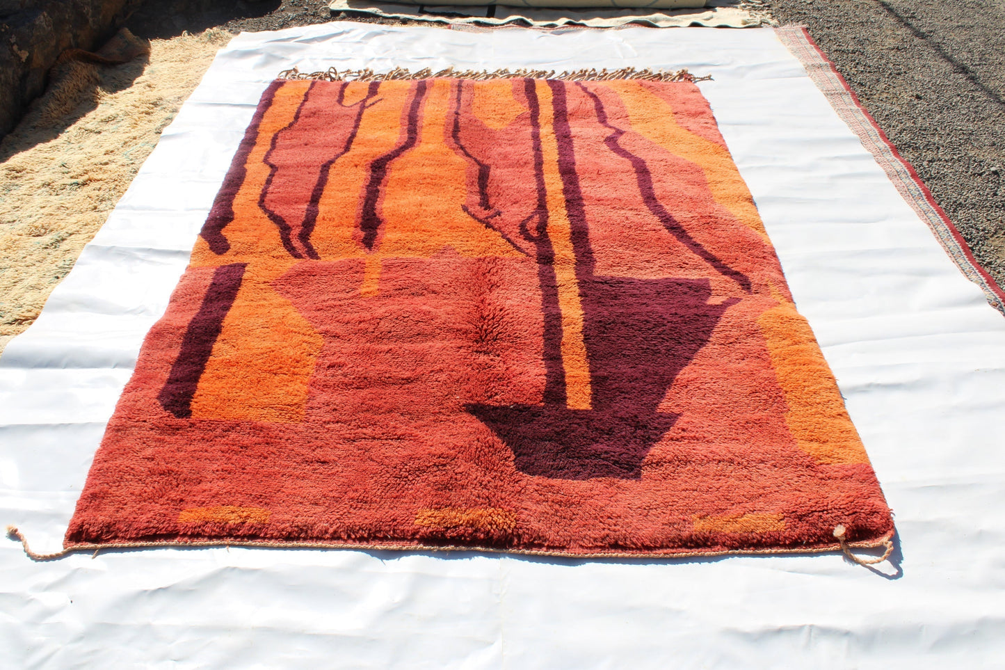 Beni Ourain rugs originate from the Atlas Mountains of Morocco and are characterized by their distinctive, neutral-toned, and geometric designs. These handwoven rugs often feature a plush pile and are made by the Berber tribes, size is 270x192 cm
