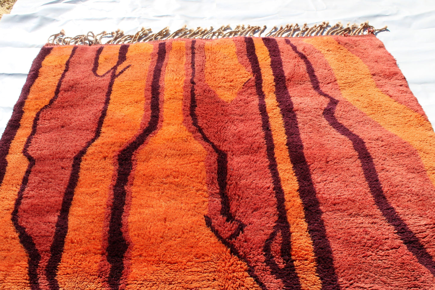 Beni Ourain rugs originate from the Atlas Mountains of Morocco and are characterized by their distinctive, neutral-toned, and geometric designs. These handwoven rugs often feature a plush pile and are made by the Berber tribes, size is 270x192 cm