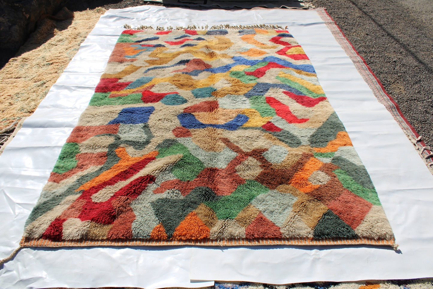 Beni Ourain rugs originate from the Atlas Mountains of Morocco and are characterized by their distinctive, neutral-toned, and geometric designs. These handwoven rugs often feature a plush pile and are made by the Berber tribes, size is 300x200 cm