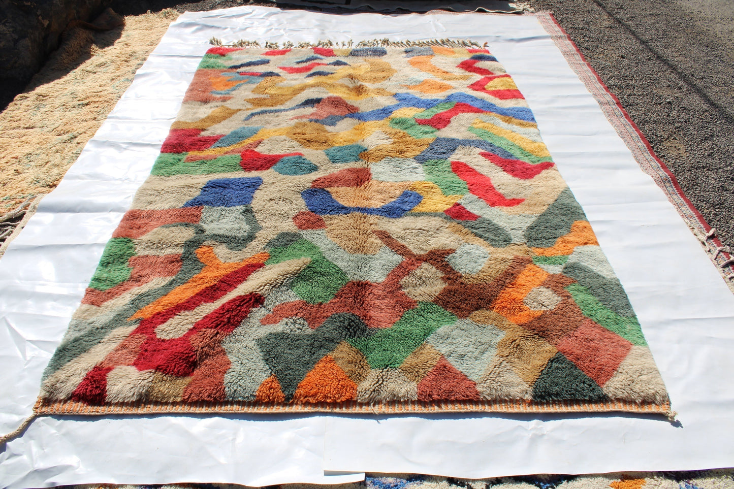 Beni Ourain rugs originate from the Atlas Mountains of Morocco and are characterized by their distinctive, neutral-toned, and geometric designs. These handwoven rugs often feature a plush pile and are made by the Berber tribes, size is 300x200 cm