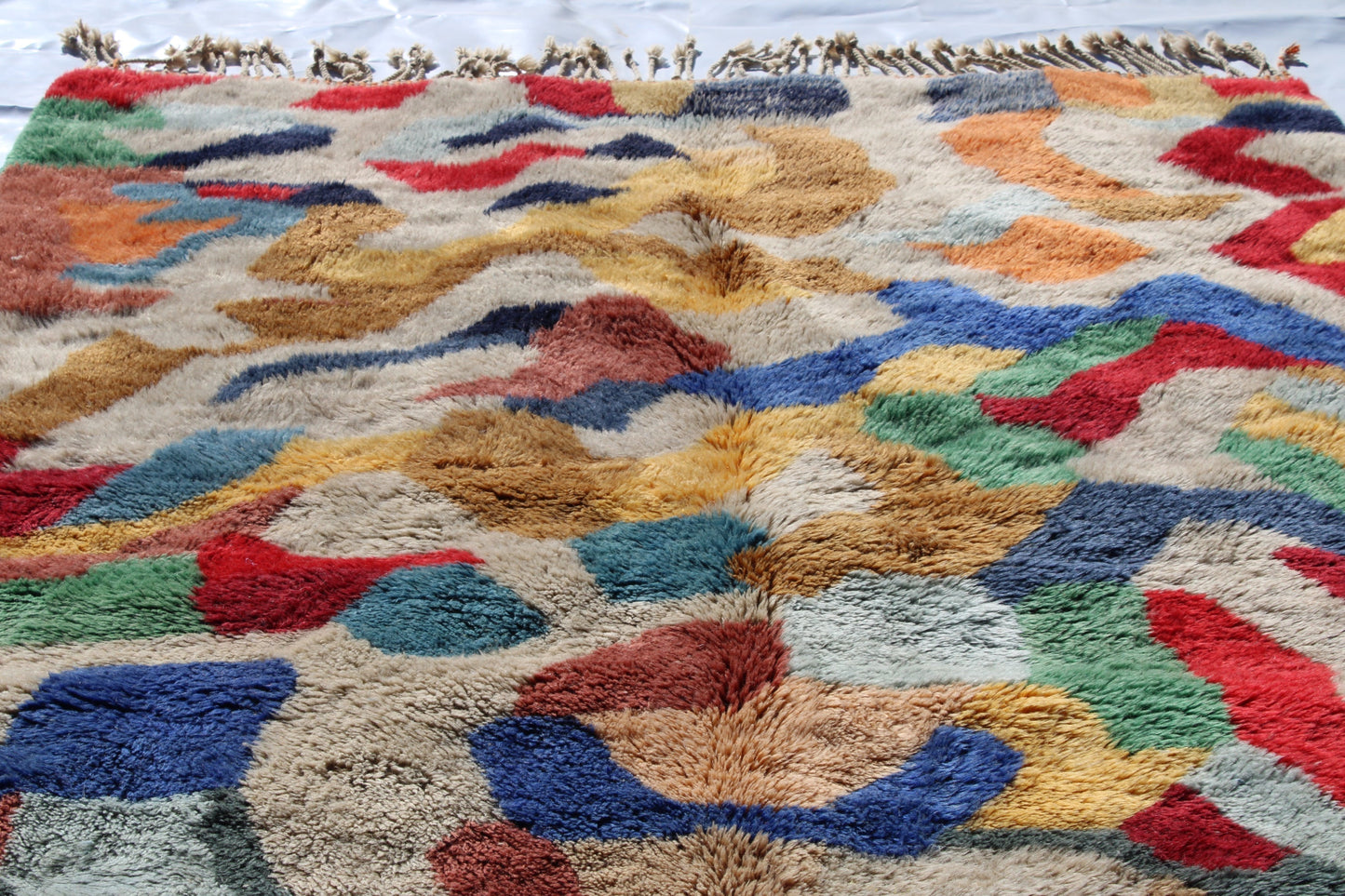 Beni Ourain rugs originate from the Atlas Mountains of Morocco and are characterized by their distinctive, neutral-toned, and geometric designs. These handwoven rugs often feature a plush pile and are made by the Berber tribes, size is 300x200 cm