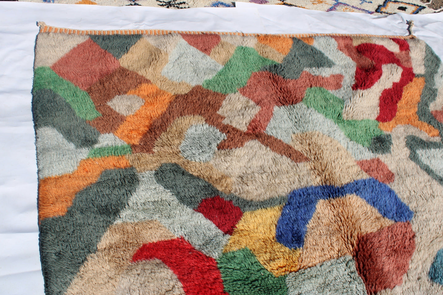 Beni Ourain rugs originate from the Atlas Mountains of Morocco and are characterized by their distinctive, neutral-toned, and geometric designs. These handwoven rugs often feature a plush pile and are made by the Berber tribes, size is 300x200 cm