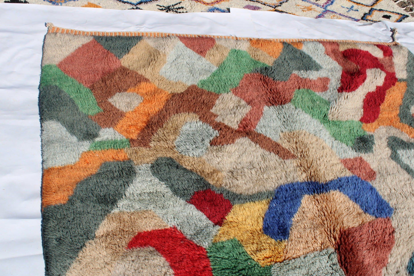 Beni Ourain rugs originate from the Atlas Mountains of Morocco and are characterized by their distinctive, neutral-toned, and geometric designs. These handwoven rugs often feature a plush pile and are made by the Berber tribes, size is 300x200 cm