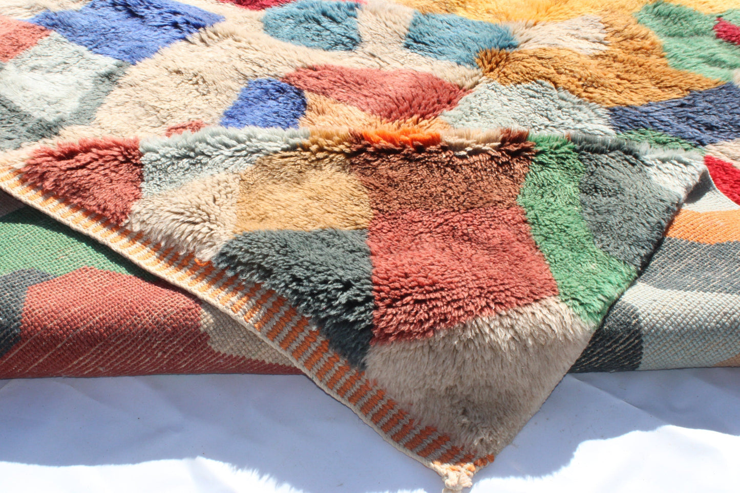 Beni Ourain rugs originate from the Atlas Mountains of Morocco and are characterized by their distinctive, neutral-toned, and geometric designs. These handwoven rugs often feature a plush pile and are made by the Berber tribes, size is 300x200 cm