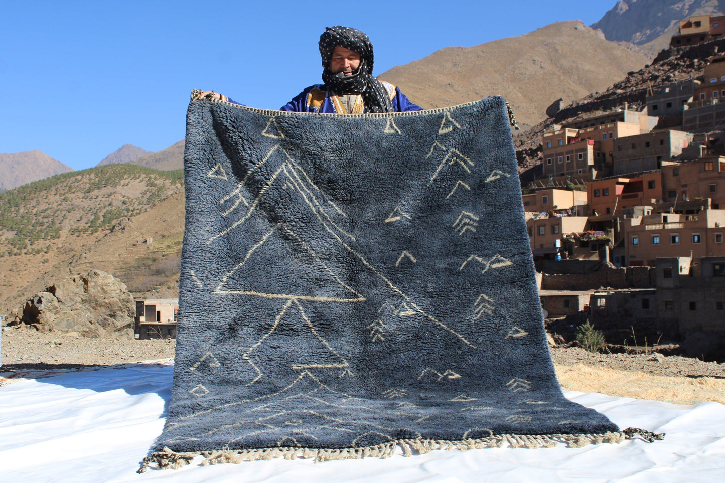 Beni Ourain rugs originate from the Atlas Mountains of Morocco and are characterized by their distinctive, neutral-toned, and geometric designs. These handwoven rugs often feature a plush pile and are made by the Berber tribes, size is 210x160 cm