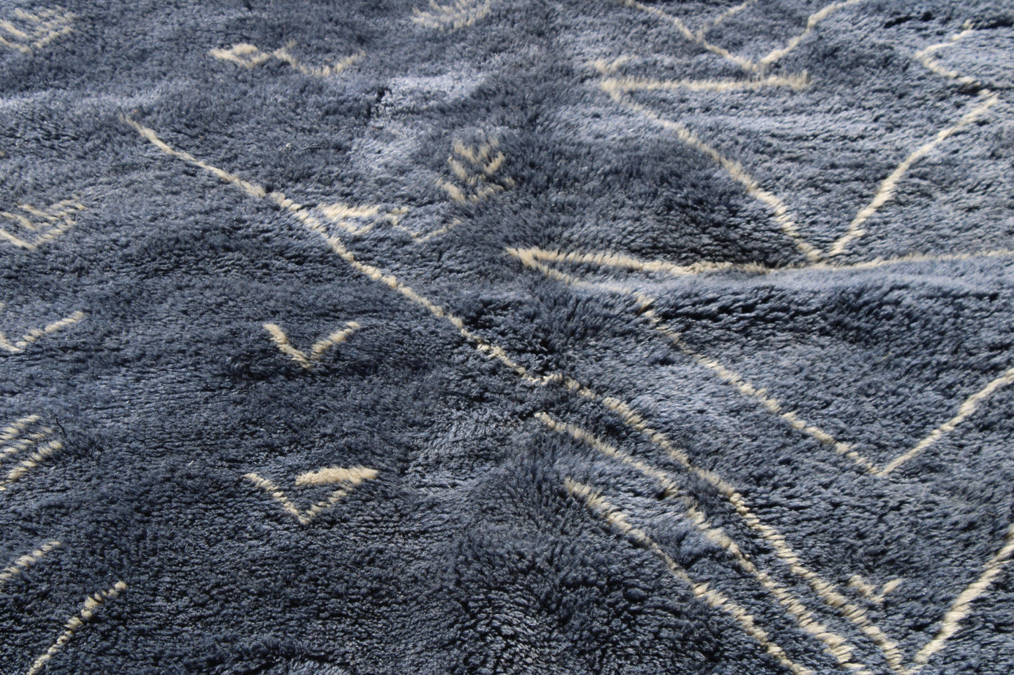 Beni Ourain rugs originate from the Atlas Mountains of Morocco and are characterized by their distinctive, neutral-toned, and geometric designs. These handwoven rugs often feature a plush pile and are made by the Berber tribes, size is 210x160 cm