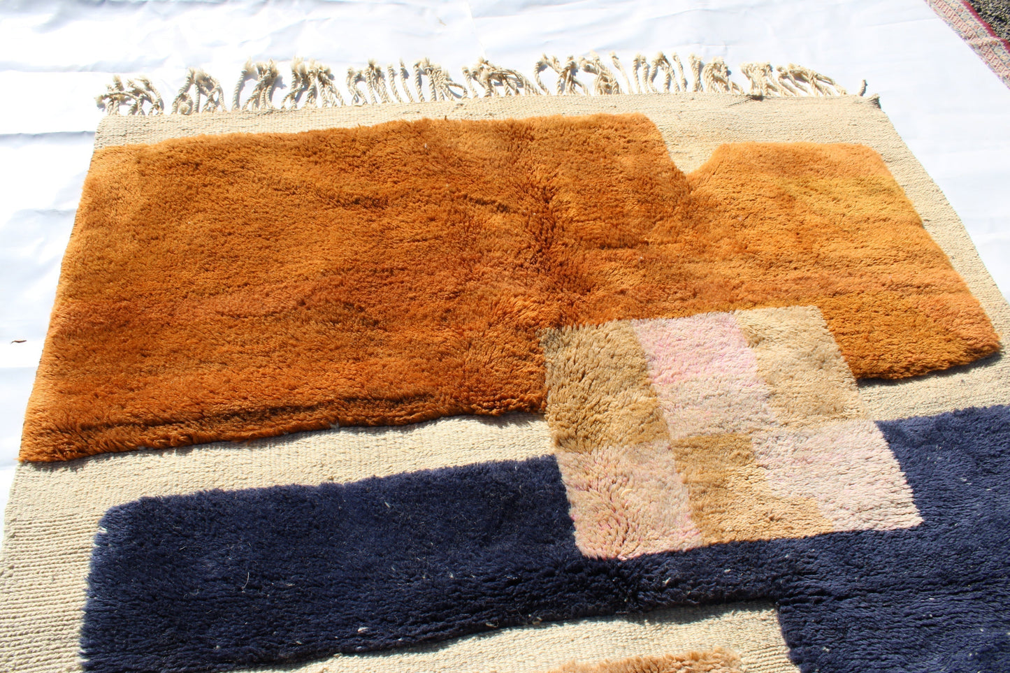 Beni Ourain rugs originate from the Atlas Mountains of Morocco and are characterized by their distinctive, neutral-toned, and geometric designs. These handwoven rugs often feature a plush pile and are made by the Berber tribes, size is 260x165 cm