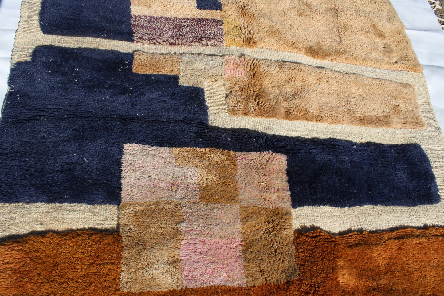 Beni Ourain rugs originate from the Atlas Mountains of Morocco and are characterized by their distinctive, neutral-toned, and geometric designs. These handwoven rugs often feature a plush pile and are made by the Berber tribes, size is 260x165 cm