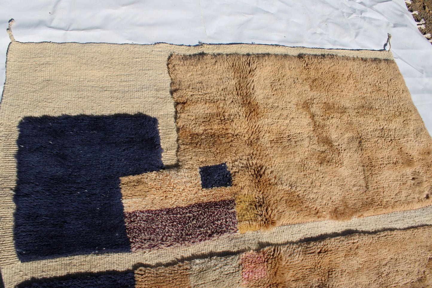 Beni Ourain rugs originate from the Atlas Mountains of Morocco and are characterized by their distinctive, neutral-toned, and geometric designs. These handwoven rugs often feature a plush pile and are made by the Berber tribes, size is 260x165 cm