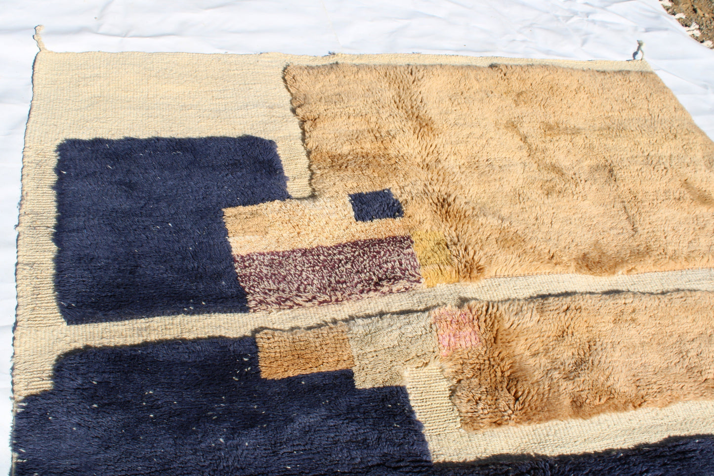 Beni Ourain rugs originate from the Atlas Mountains of Morocco and are characterized by their distinctive, neutral-toned, and geometric designs. These handwoven rugs often feature a plush pile and are made by the Berber tribes, size is 260x165 cm