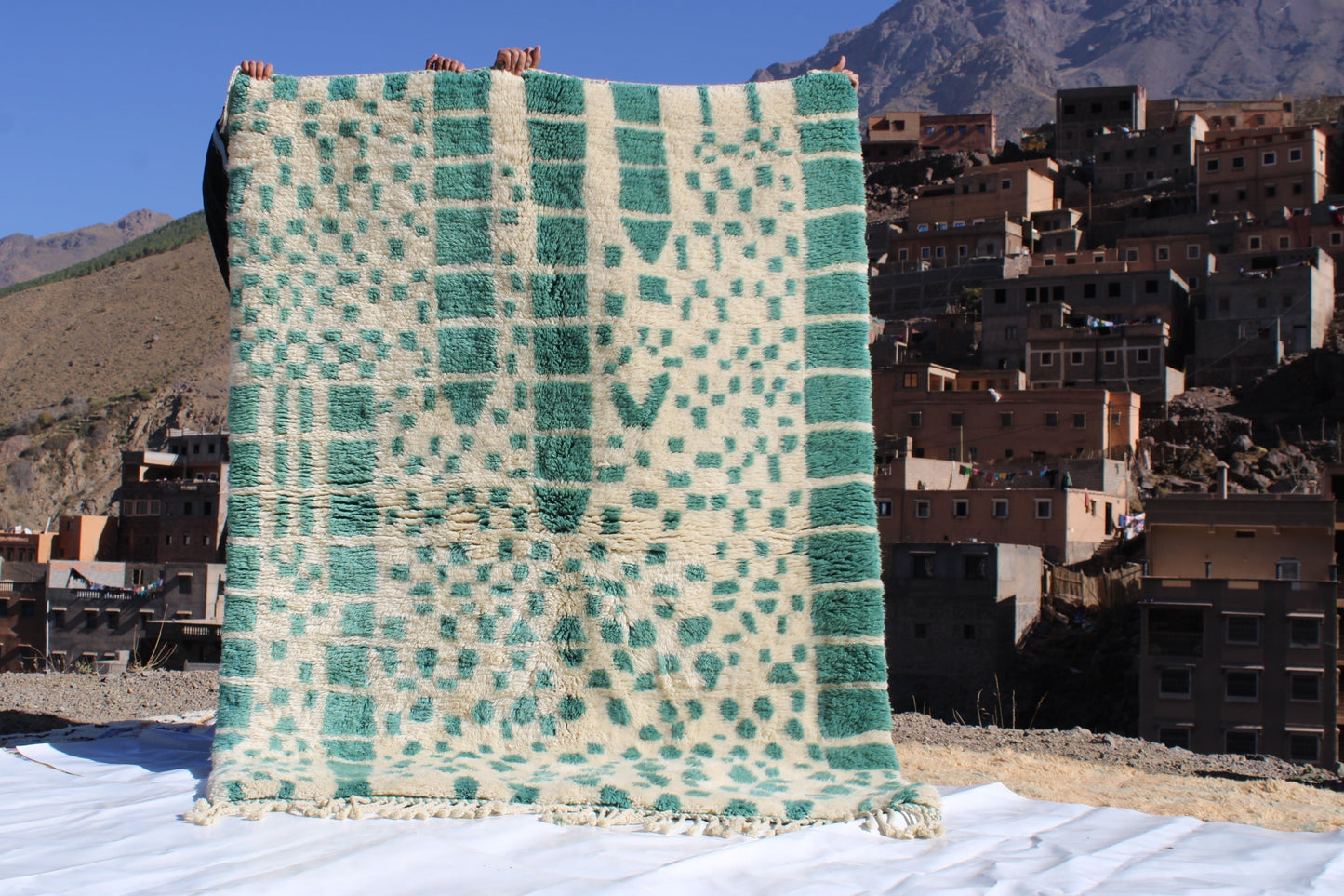 Beni Ourain rugs originate from the Atlas Mountains of Morocco and are characterized by their distinctive, neutral-toned, and geometric designs. These handwoven rugs often feature a plush pile and are made by the Berber tribes, size is 215x160 cm