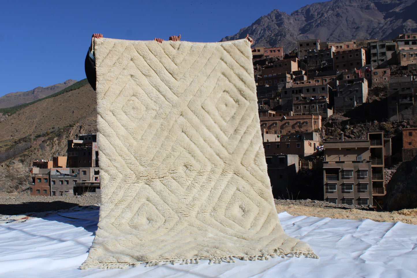 Beni Ourain rugs originate from the Atlas Mountains of Morocco and are characterized by their distinctive, neutral-toned, and geometric designs. These handwoven rugs often feature a plush pile and are made by the Berber tribes, size is 260x150 cm