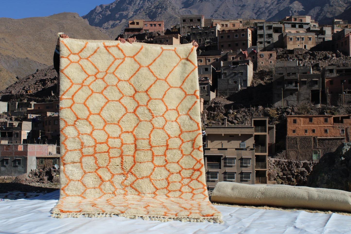 Beni Ourain rugs originate from the Atlas Mountains of Morocco and are characterized by their distinctive, neutral-toned, and geometric designs. These handwoven rugs often feature a plush pile and are made by the Berber tribes, size is 255x155 cm