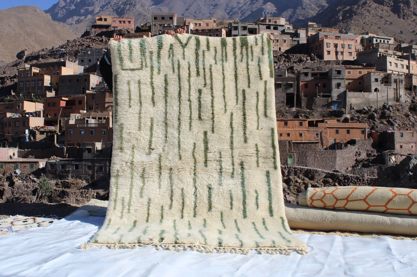 Beni Ourain rugs originate from the Atlas Mountains of Morocco and are characterized by their distinctive, neutral-toned, and geometric designs. These handwoven rugs often feature a plush pile and are made by the Berber tribes, size is 255x155 cm