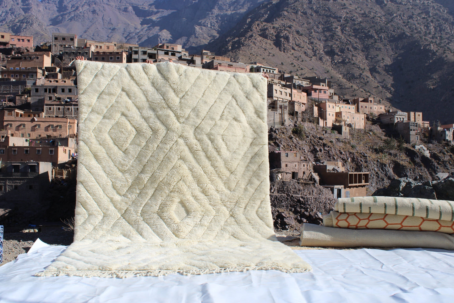 Beni Ourain rugs originate from the Atlas Mountains of Morocco and are characterized by their distinctive, neutral-toned, and geometric designs. These handwoven rugs often feature a plush pile and are made by the Berber tribes, size is 300x200 cm