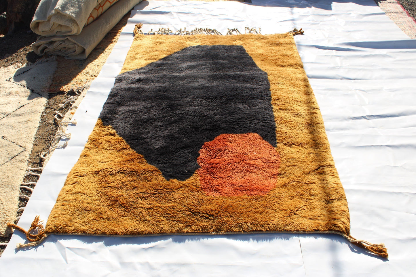 Beni Ourain rugs originate from the Atlas Mountains of Morocco and are characterized by their distinctive, neutral-toned, and geometric designs. These handwoven rugs often feature a plush pile and are made by the Berber tribes, size is 240x150 cm
