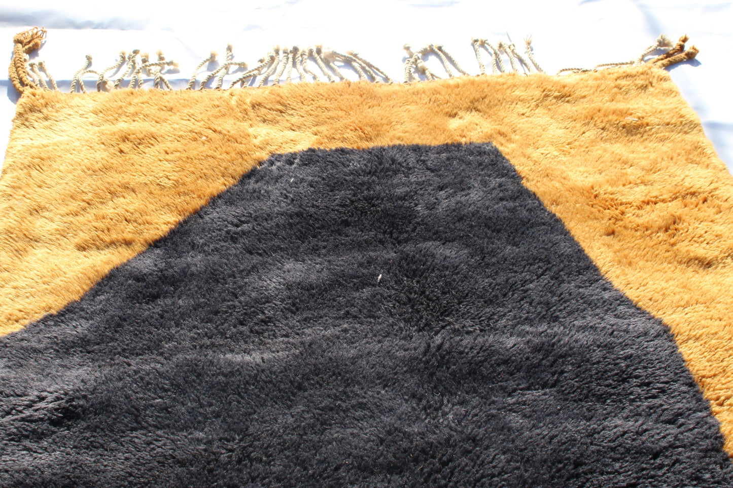 Beni Ourain rugs originate from the Atlas Mountains of Morocco and are characterized by their distinctive, neutral-toned, and geometric designs. These handwoven rugs often feature a plush pile and are made by the Berber tribes, size is 240x150 cm