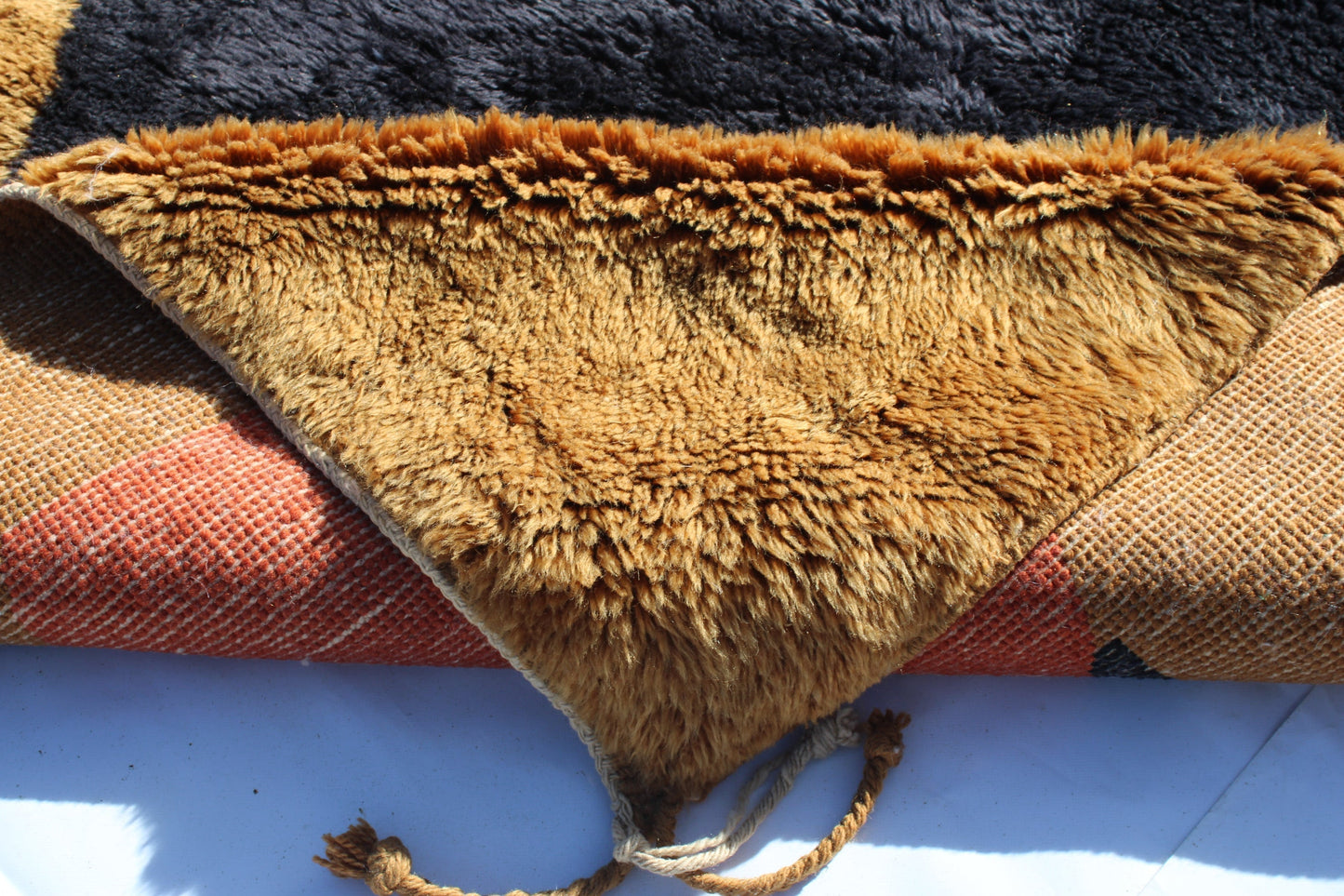 Beni Ourain rugs originate from the Atlas Mountains of Morocco and are characterized by their distinctive, neutral-toned, and geometric designs. These handwoven rugs often feature a plush pile and are made by the Berber tribes, size is 240x150 cm