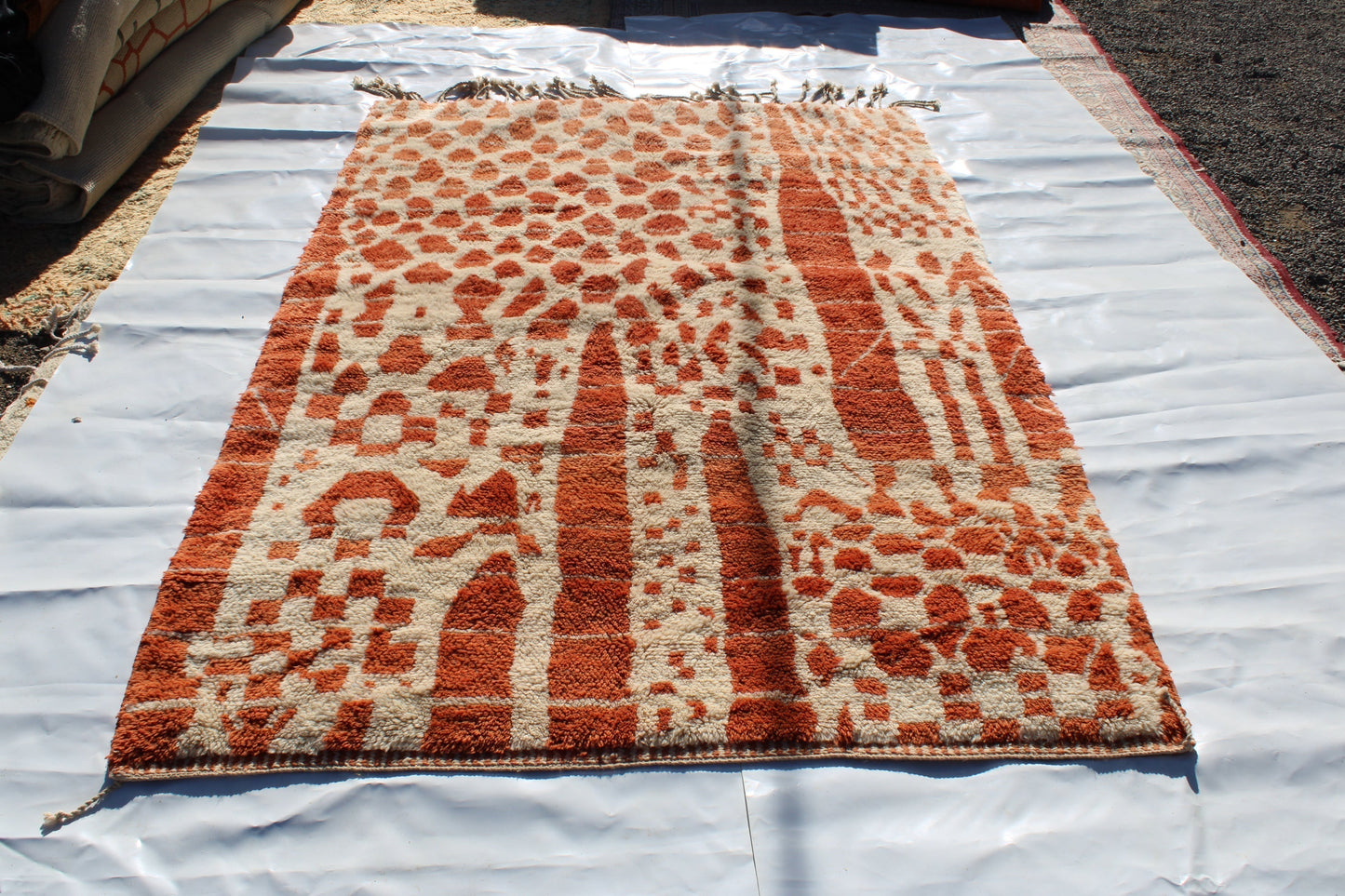 Beni Ourain rugs originate from the Atlas Mountains of Morocco and are characterized by their distinctive, neutral-toned, and geometric designs. These handwoven rugs often feature a plush pile and are made by the Berber tribes, size is 270x180 cm