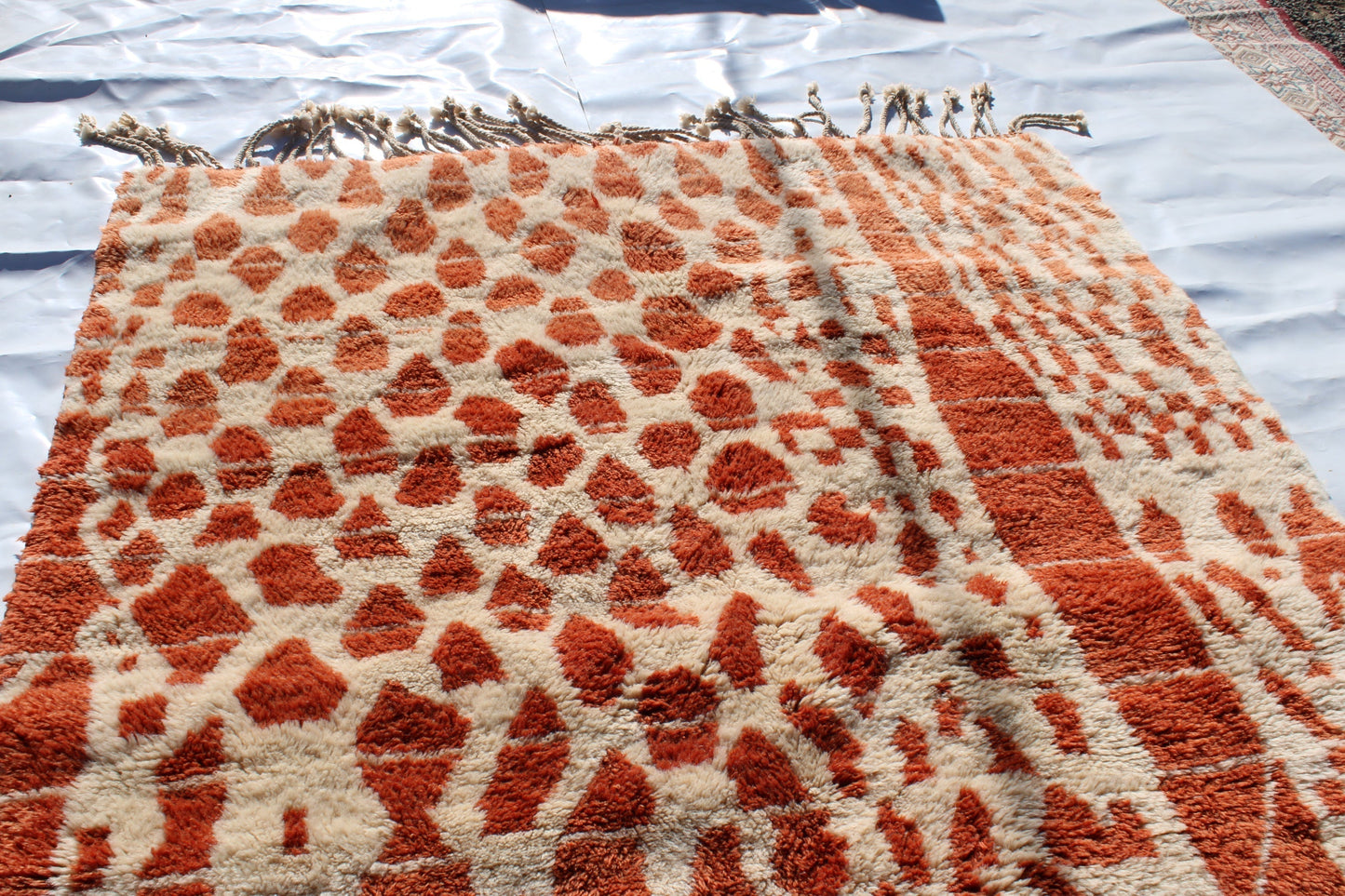 Beni Ourain rugs originate from the Atlas Mountains of Morocco and are characterized by their distinctive, neutral-toned, and geometric designs. These handwoven rugs often feature a plush pile and are made by the Berber tribes, size is 270x180 cm