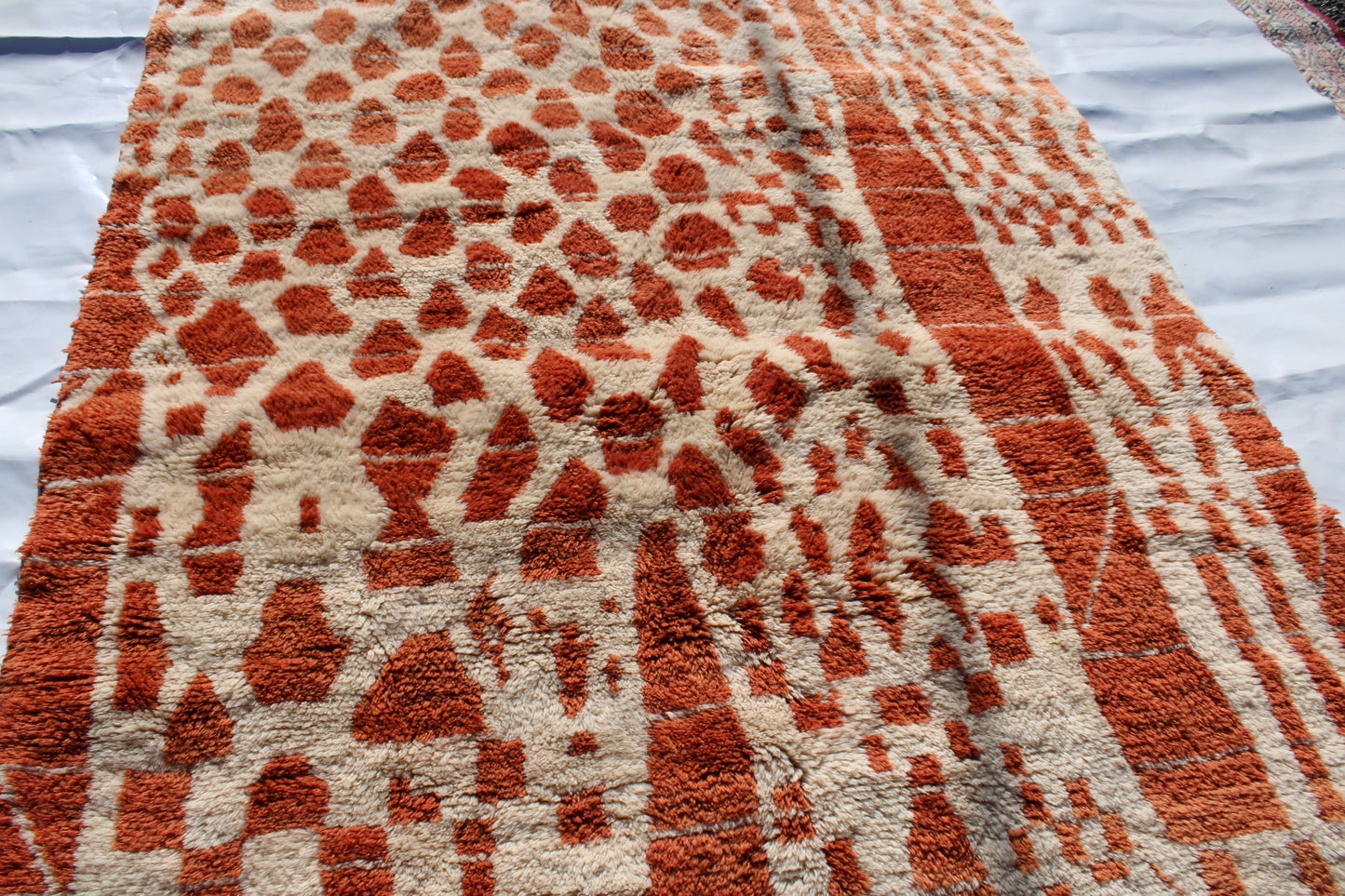 Beni Ourain rugs originate from the Atlas Mountains of Morocco and are characterized by their distinctive, neutral-toned, and geometric designs. These handwoven rugs often feature a plush pile and are made by the Berber tribes, size is 270x180 cm