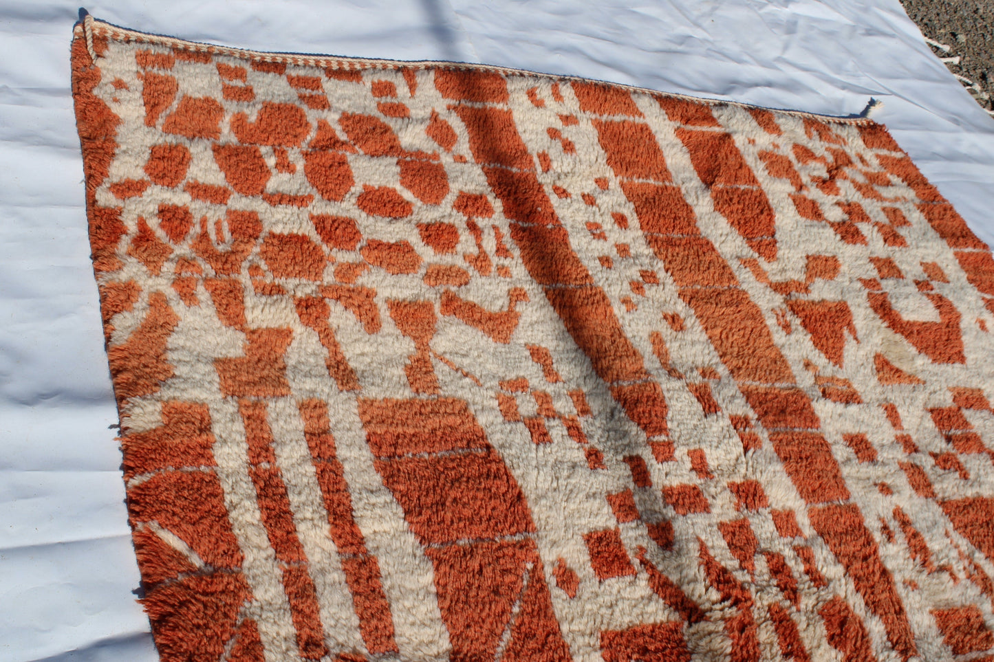 Beni Ourain rugs originate from the Atlas Mountains of Morocco and are characterized by their distinctive, neutral-toned, and geometric designs. These handwoven rugs often feature a plush pile and are made by the Berber tribes, size is 270x180 cm