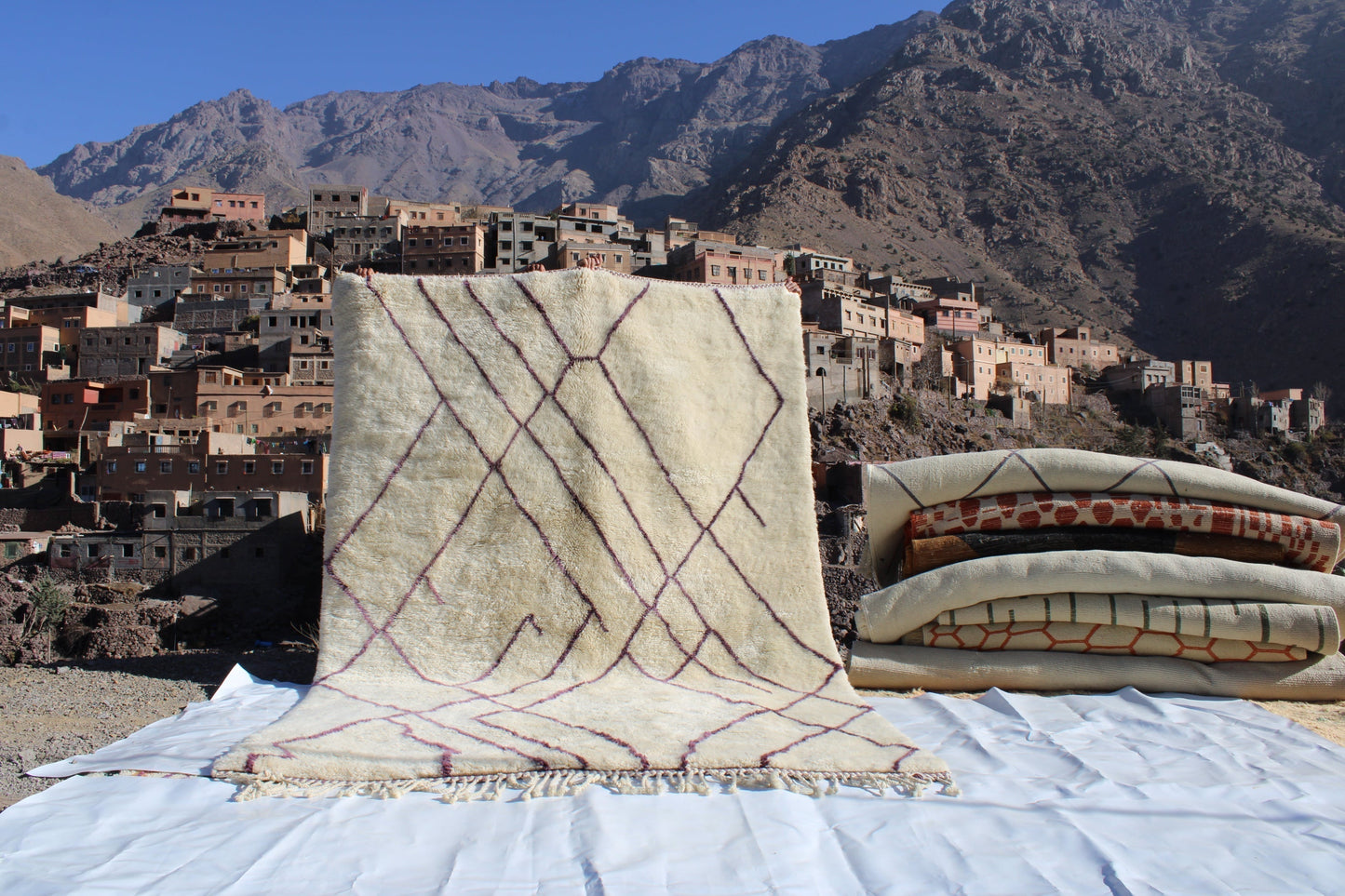 Beni Ourain rugs originate from the Atlas Mountains of Morocco and are characterized by their distinctive, neutral-toned, and geometric designs. These handwoven rugs often feature a plush pile and are made by the Berber tribes, size is 310x210 cm