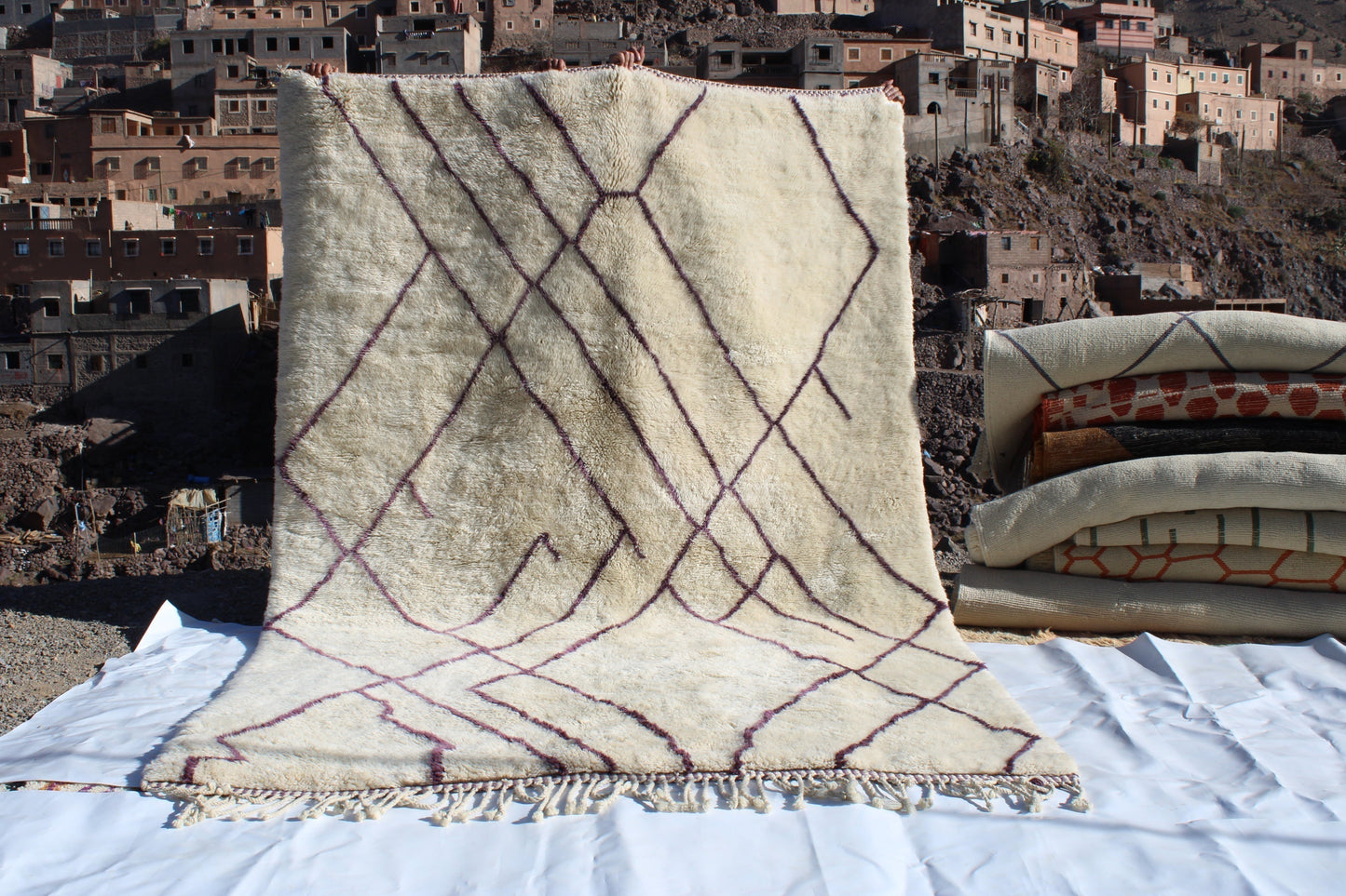 Beni Ourain rugs originate from the Atlas Mountains of Morocco and are characterized by their distinctive, neutral-toned, and geometric designs. These handwoven rugs often feature a plush pile and are made by the Berber tribes, size is 310x210 cm