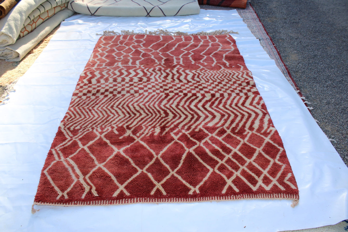 Beni Ourain rugs originate from the Atlas Mountains of Morocco and are characterized by their distinctive, neutral-toned, and geometric designs. These handwoven rugs often feature a plush pile and are made by the Berber tribes, size is 270x168 cm