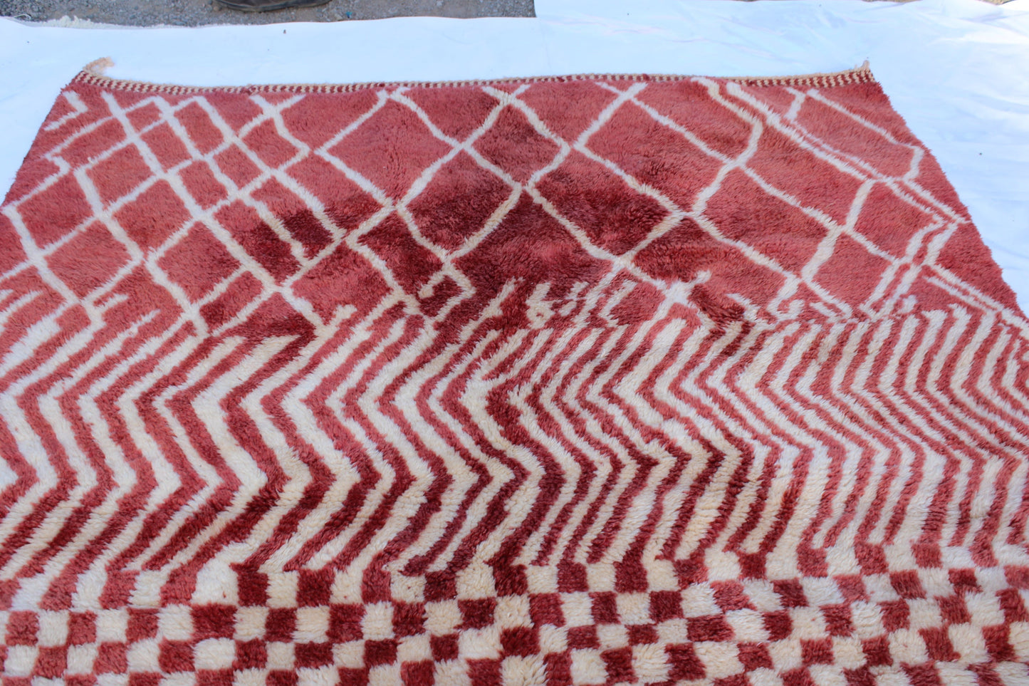 Beni Ourain rugs originate from the Atlas Mountains of Morocco and are characterized by their distinctive, neutral-toned, and geometric designs. These handwoven rugs often feature a plush pile and are made by the Berber tribes, size is 270x168 cm