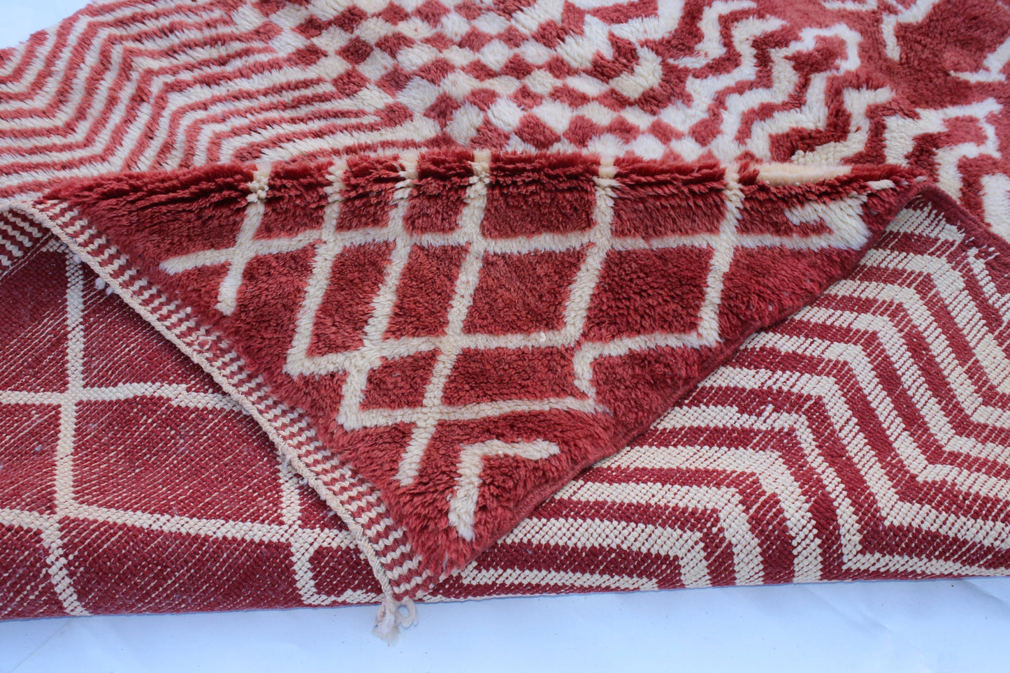 Beni Ourain rugs originate from the Atlas Mountains of Morocco and are characterized by their distinctive, neutral-toned, and geometric designs. These handwoven rugs often feature a plush pile and are made by the Berber tribes, size is 270x168 cm