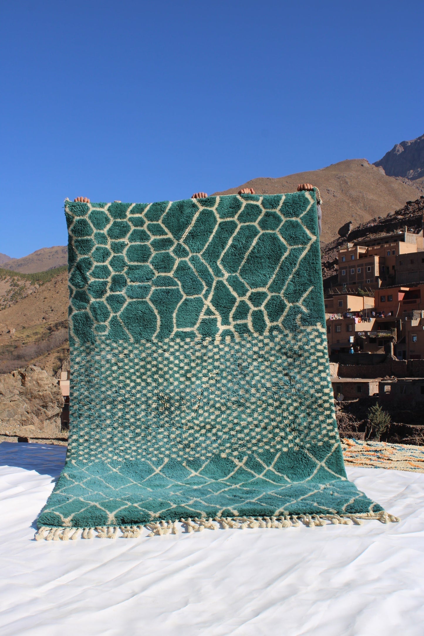 Beni Ourain rugs originate from the Atlas Mountains of Morocco and are characterized by their distinctive, neutral-toned, and geometric designs. These handwoven rugs often feature a plush pile and are made by the Berber tribes, size is 250x150cm