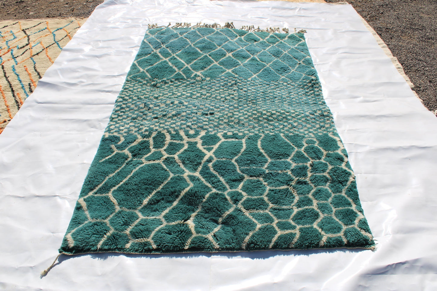 Beni Ourain rugs originate from the Atlas Mountains of Morocco and are characterized by their distinctive, neutral-toned, and geometric designs. These handwoven rugs often feature a plush pile and are made by the Berber tribes, size is 250x150cm