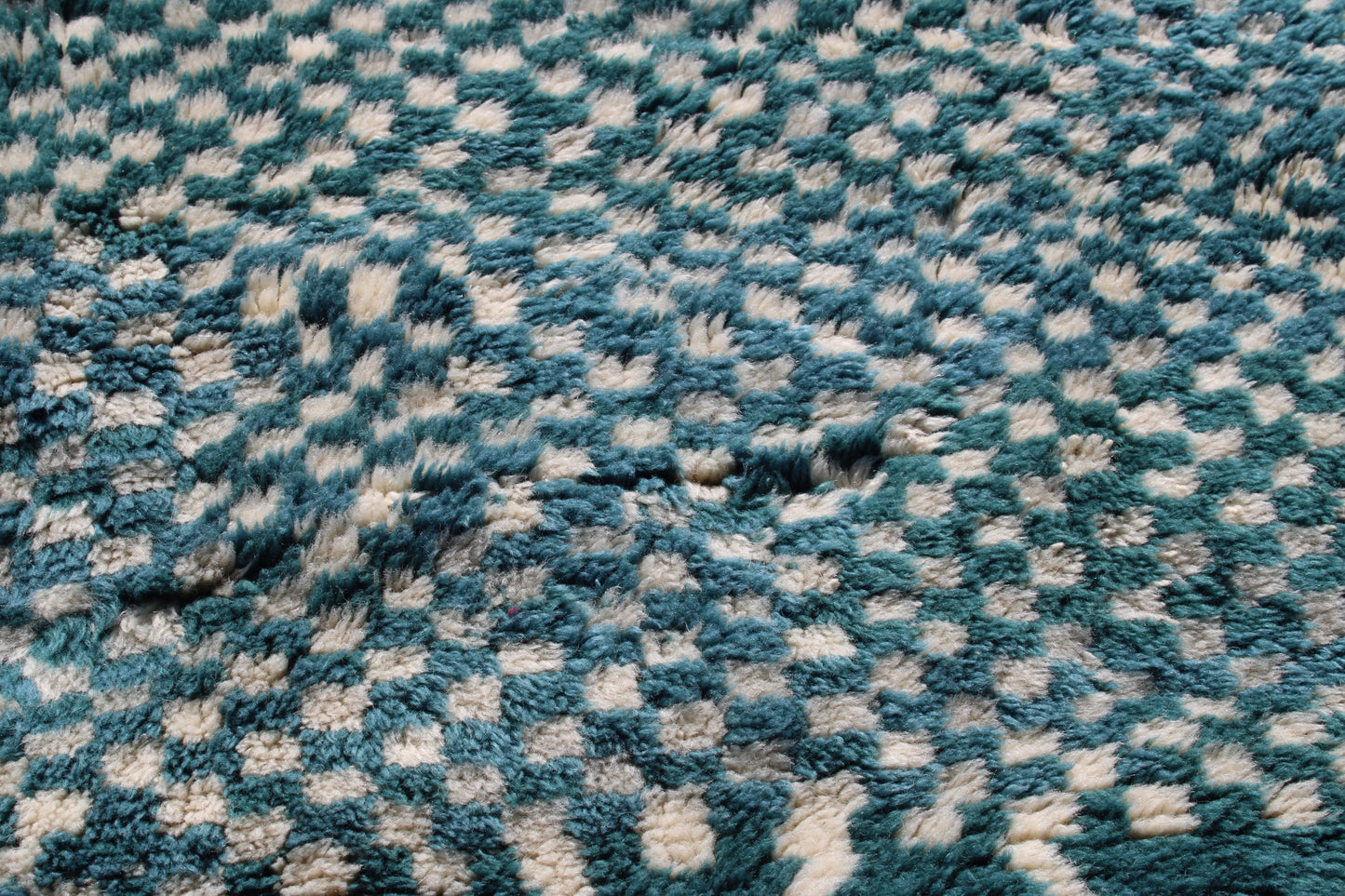 Beni Ourain rugs originate from the Atlas Mountains of Morocco and are characterized by their distinctive, neutral-toned, and geometric designs. These handwoven rugs often feature a plush pile and are made by the Berber tribes, size is 250x150cm