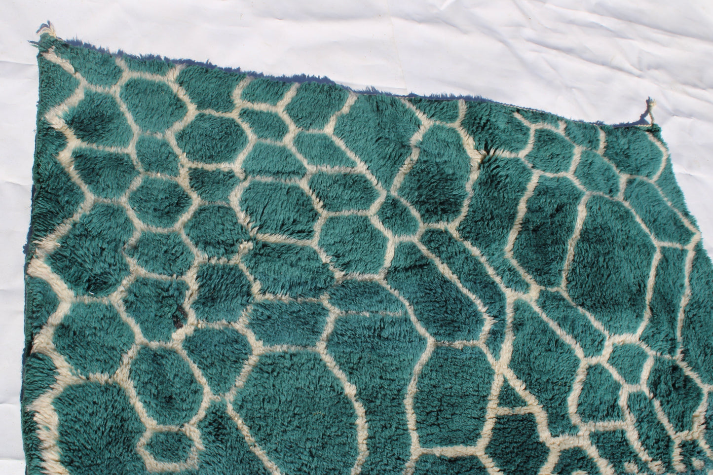 Beni Ourain rugs originate from the Atlas Mountains of Morocco and are characterized by their distinctive, neutral-toned, and geometric designs. These handwoven rugs often feature a plush pile and are made by the Berber tribes, size is 250x150cm