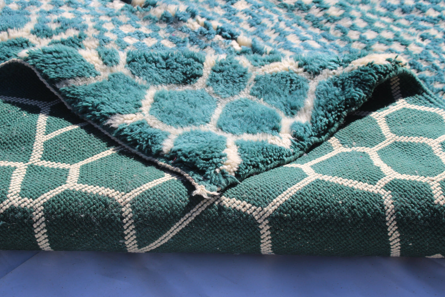 Beni Ourain rugs originate from the Atlas Mountains of Morocco and are characterized by their distinctive, neutral-toned, and geometric designs. These handwoven rugs often feature a plush pile and are made by the Berber tribes, size is 260x192 cm