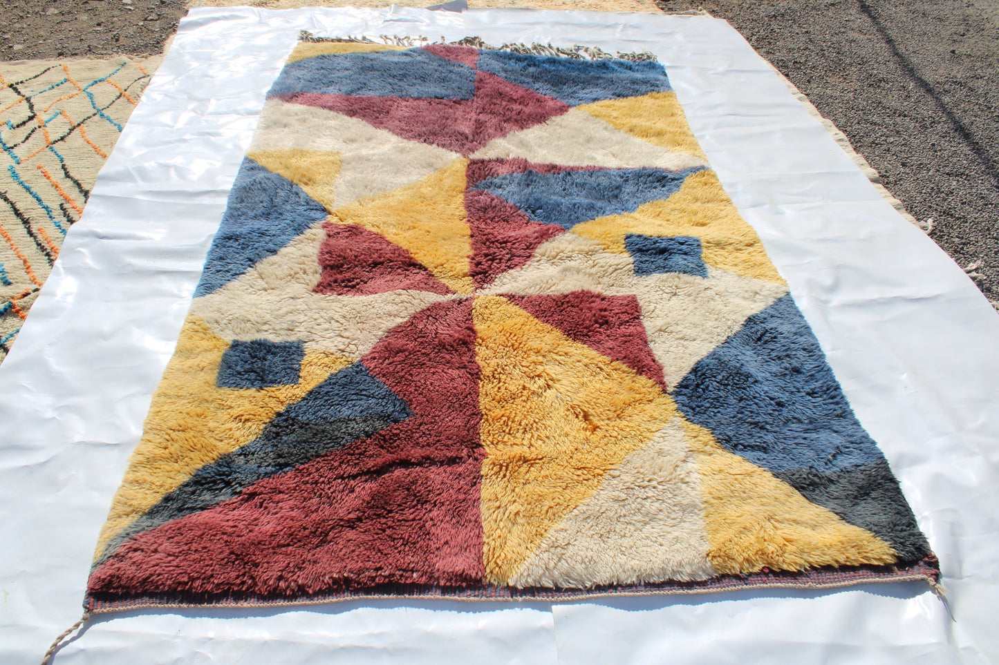 Beni Ourain rugs originate from the Atlas Mountains of Morocco and are characterized by their distinctive, neutral-toned, and geometric designs. These handwoven rugs often feature a plush pile and are made by the Berber tribes, size is 300x180 cm