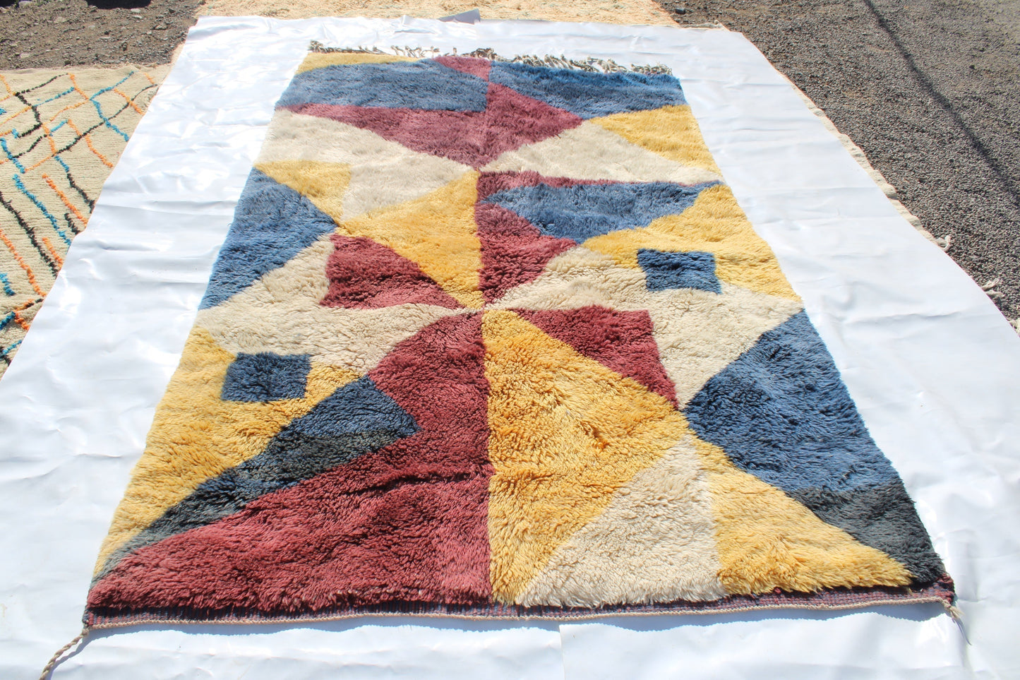Beni Ourain rugs originate from the Atlas Mountains of Morocco and are characterized by their distinctive, neutral-toned, and geometric designs. These handwoven rugs often feature a plush pile and are made by the Berber tribes, size is 280x177 cm