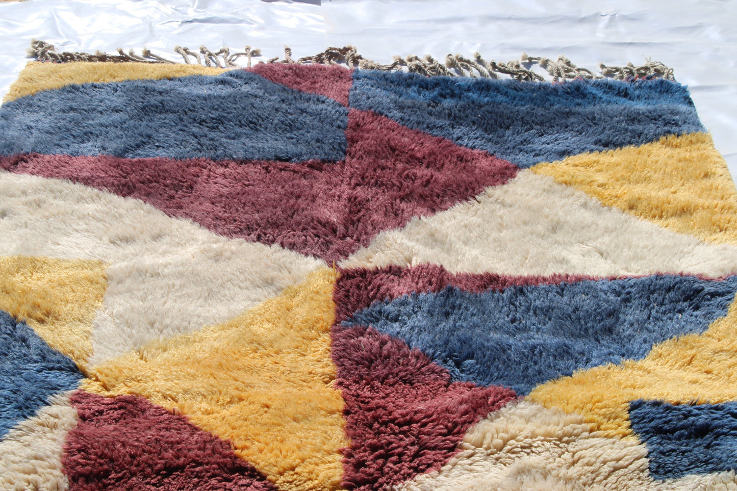 Beni Ourain rugs originate from the Atlas Mountains of Morocco and are characterized by their distinctive, neutral-toned, and geometric designs. These handwoven rugs often feature a plush pile and are made by the Berber tribes, size is 300x180 cm