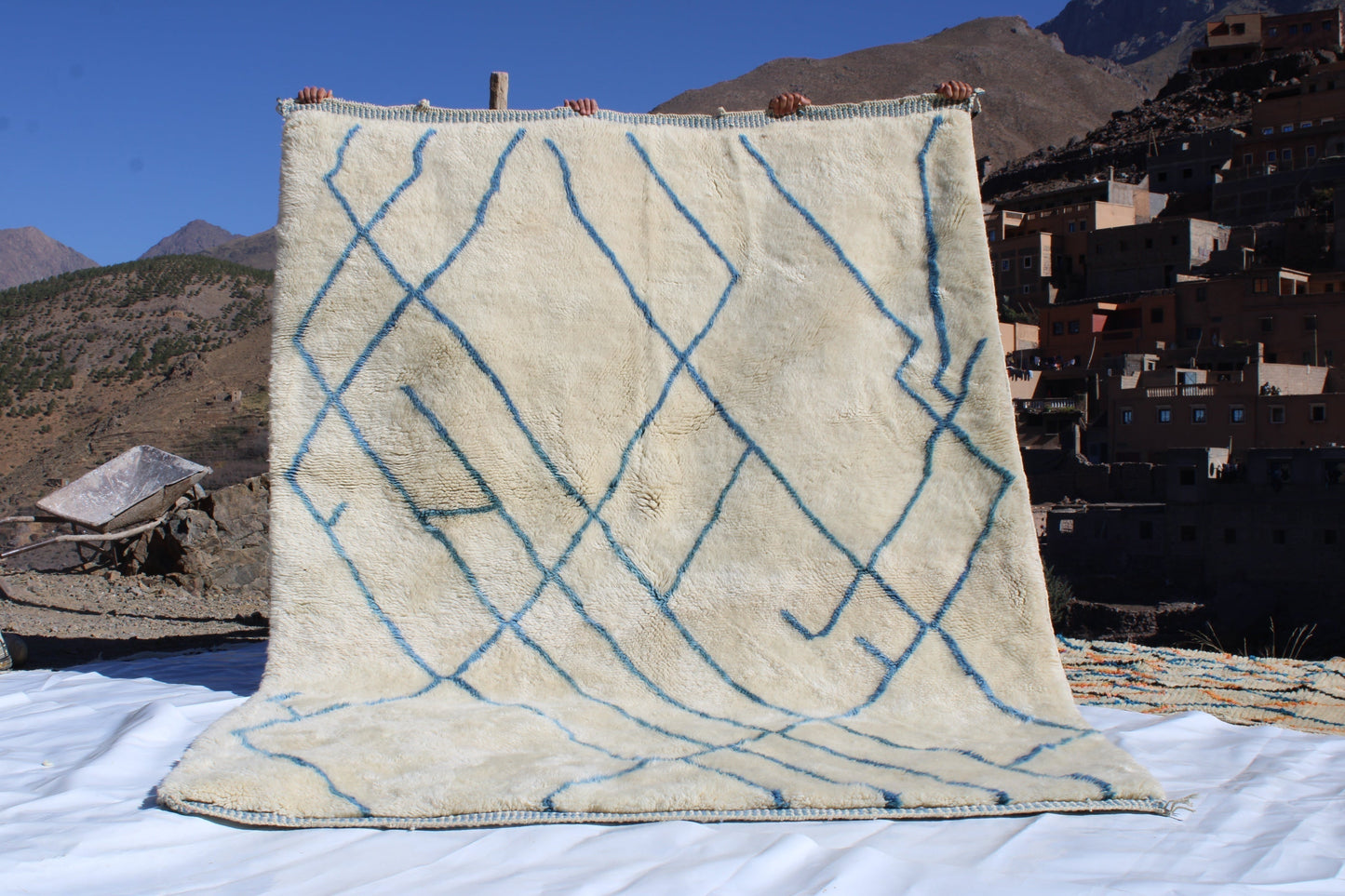 Beni Ourain rugs originate from the Atlas Mountains of Morocco and are characterized by their distinctive, neutral-toned, and geometric designs. These handwoven rugs often feature a plush pile and are made by the Berber tribes, size is 270x192 cm