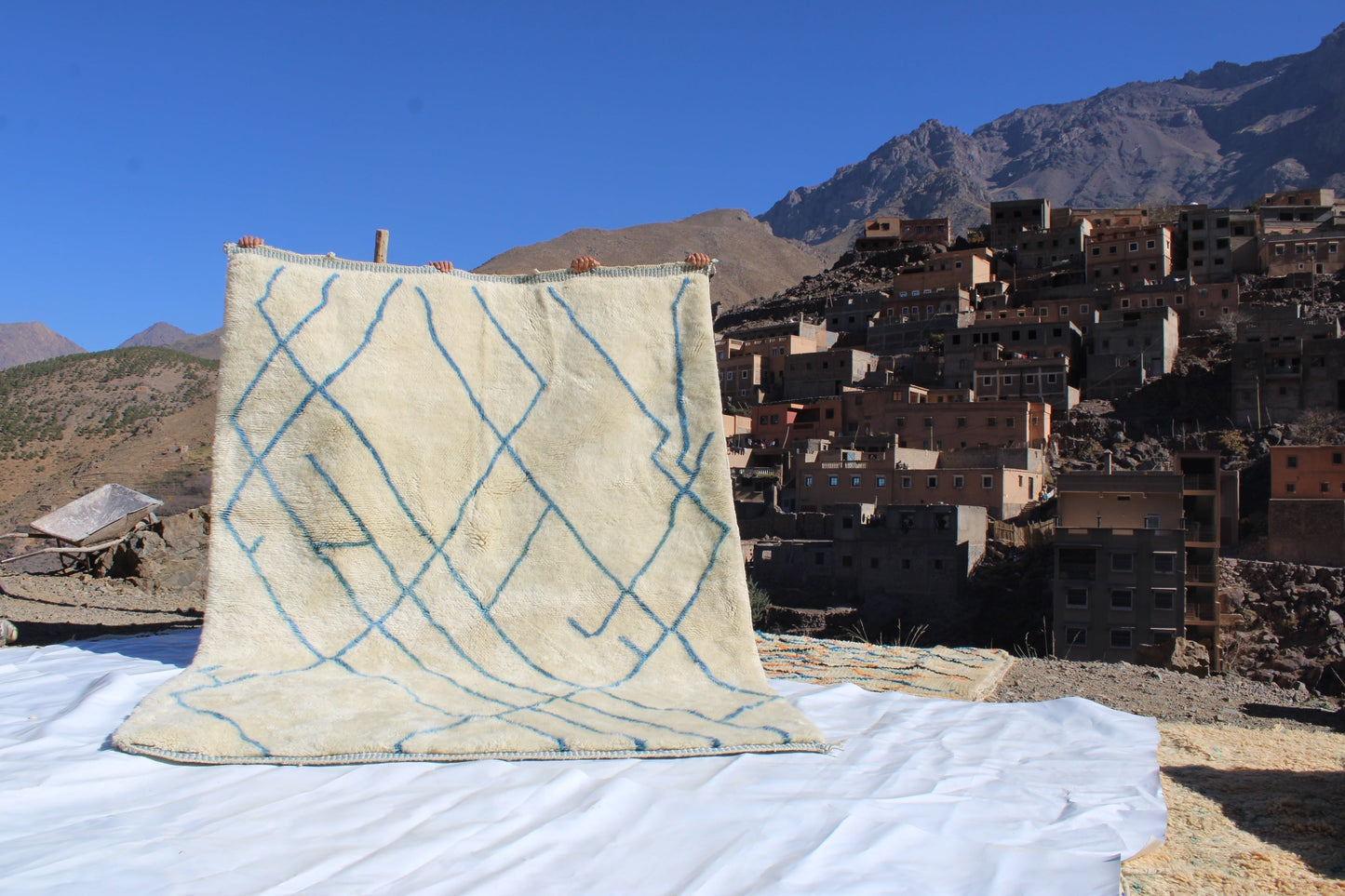 Beni Ourain rugs originate from the Atlas Mountains of Morocco and are characterized by their distinctive, neutral-toned, and geometric designs. These handwoven rugs often feature a plush pile and are made by the Berber tribes, size is 270x192 cm