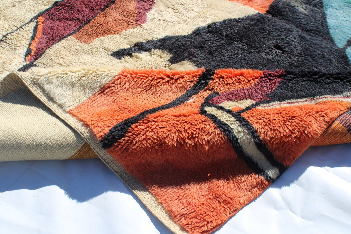 Beni Ourain rugs originate from the Atlas Mountains of Morocco and are characterized by their distinctive, neutral-toned, and geometric designs. These handwoven rugs often feature a plush pile and are made by the Berber tribes, size is 270x192 cm