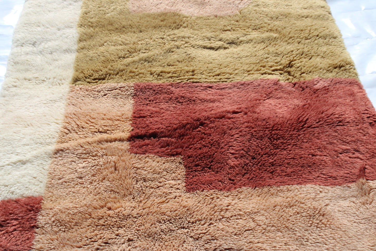 Copy of Beni Ourain rugs originate from the Atlas Mountains of Morocco and are characterized by their distinctive, neutral-toned, and geometric designs. These handwoven rugs often feature a plush pile and are made by the Berber tribes, size is 190x120cm