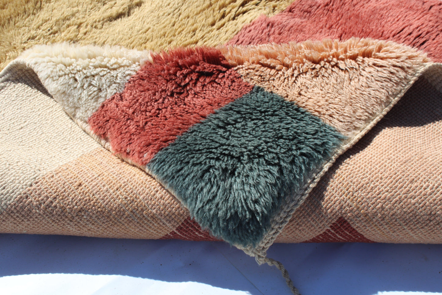 Copy of Beni Ourain rugs originate from the Atlas Mountains of Morocco and are characterized by their distinctive, neutral-toned, and geometric designs. These handwoven rugs often feature a plush pile and are made by the Berber tribes, size is 190x120cm