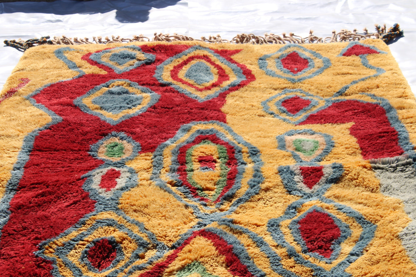 Beni Ourain rugs originate from the Atlas Mountains of Morocco and are characterized by their distinctive, neutral-toned, and geometric designs. These handwoven rugs often feature a plush pile and are made by the Berber tribes, size is 270x180 cm