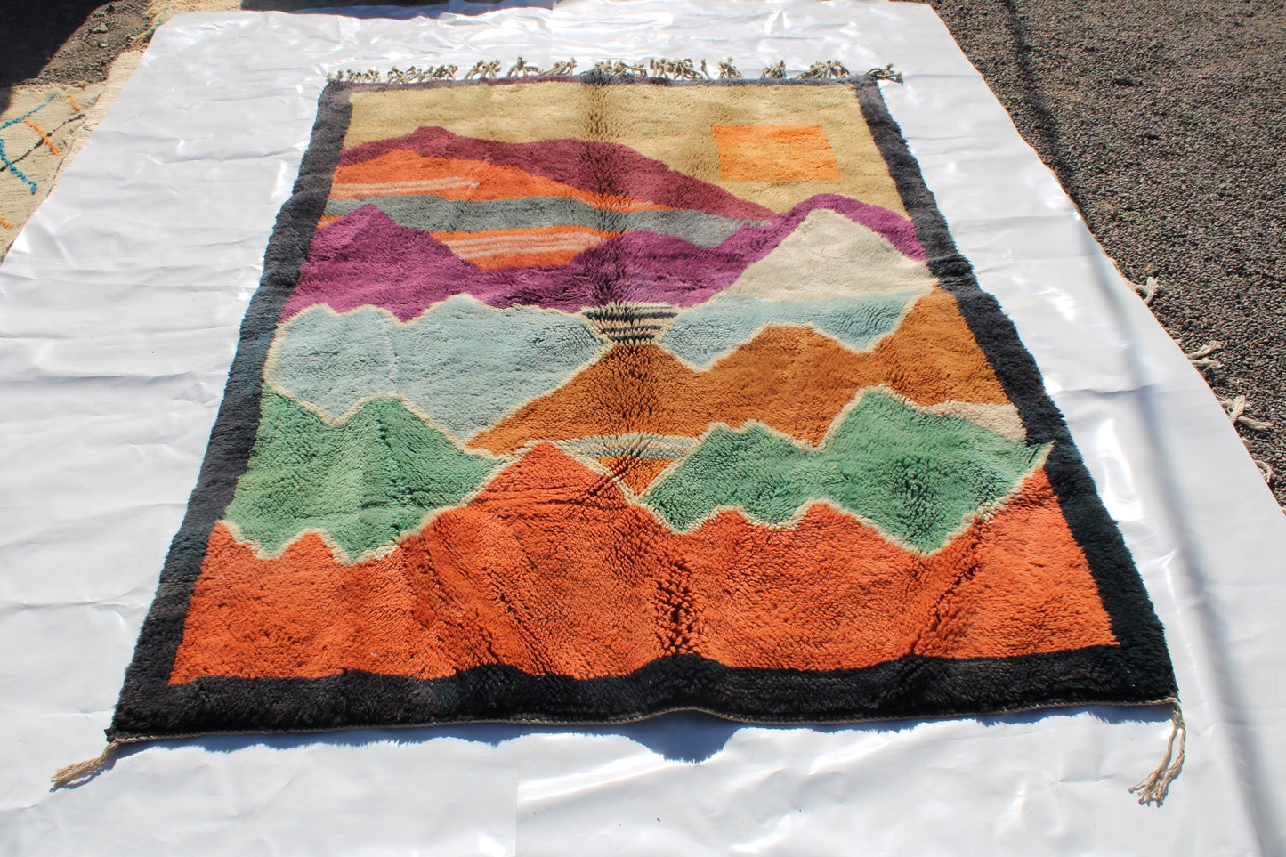 Beni Ourain rugs originate from the Atlas Mountains of Morocco and are characterized by their distinctive, neutral-toned, and geometric designs. These handwoven rugs often feature a plush pile and are made by the Berber tribes, size is 270x192 cm
